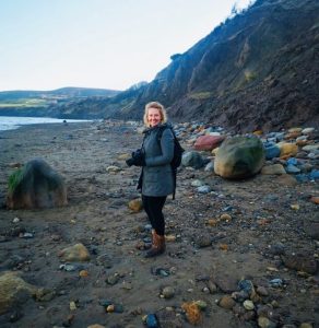 Photographer Rebecca Rowan on a beach