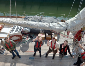 Picture of staff and patients on board a boat