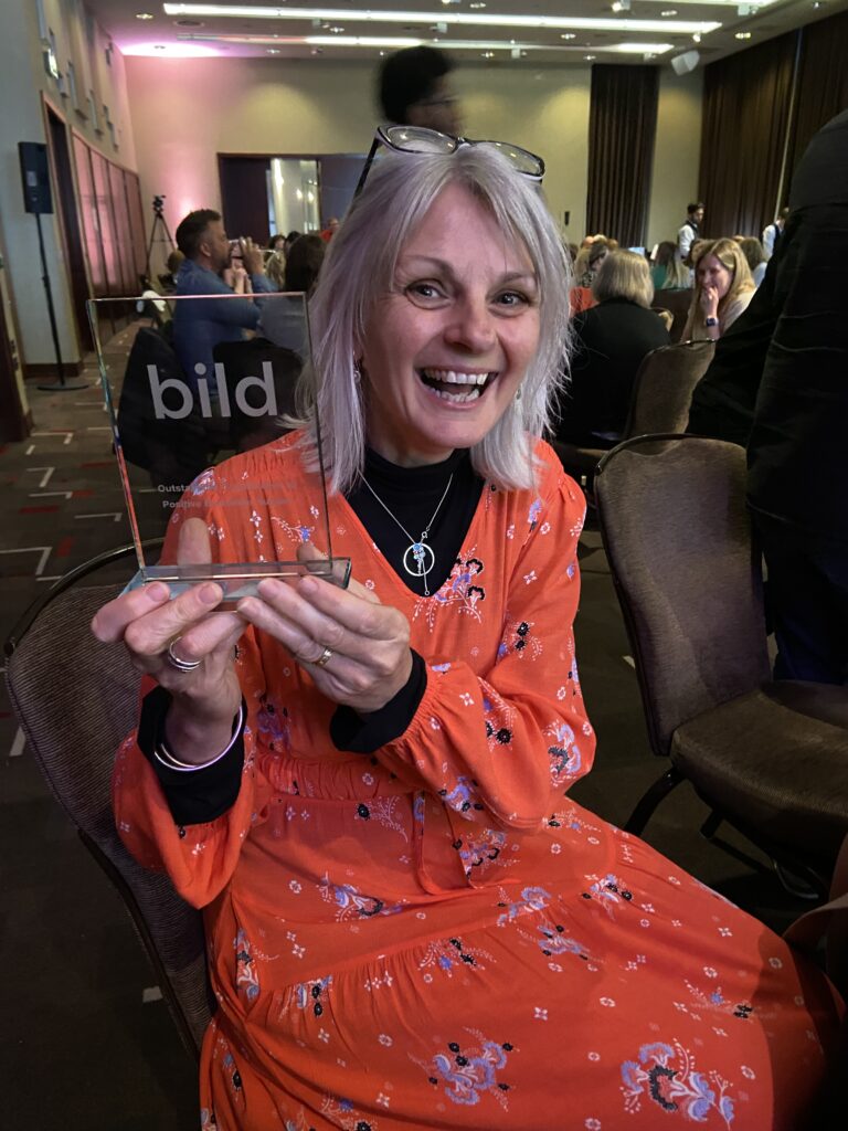 Debbie Austin with her award