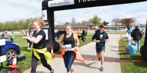 Runners crossing the finish line at the 2024 TEWV 10l